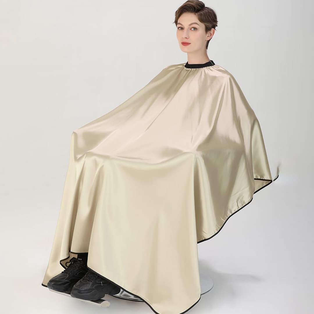 Soft and breathable custom salon cape fabric providing client comfort during salon services