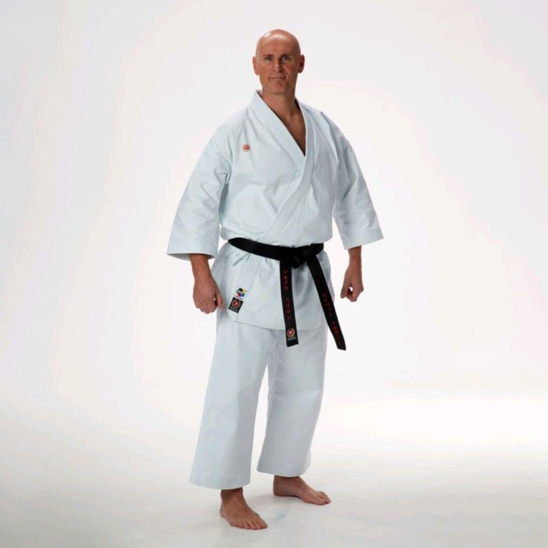 Close-up of custom jiu jitsu uniform fabric showcasing reinforced stitching and durable texture, designed for intense martial arts training.